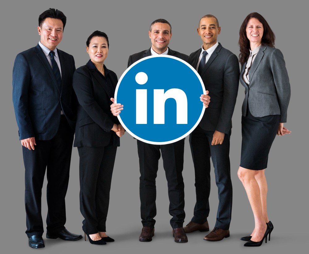 group of people holding linkedin icon